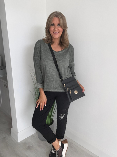 Relaxed fit long sleeve top with a V-neckline, soft washed finish, and breathable fabric, available in multiple colors