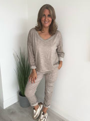 Relaxed fit long sleeve top with a V-neckline, soft washed finish, and breathable fabric, available in multiple colors