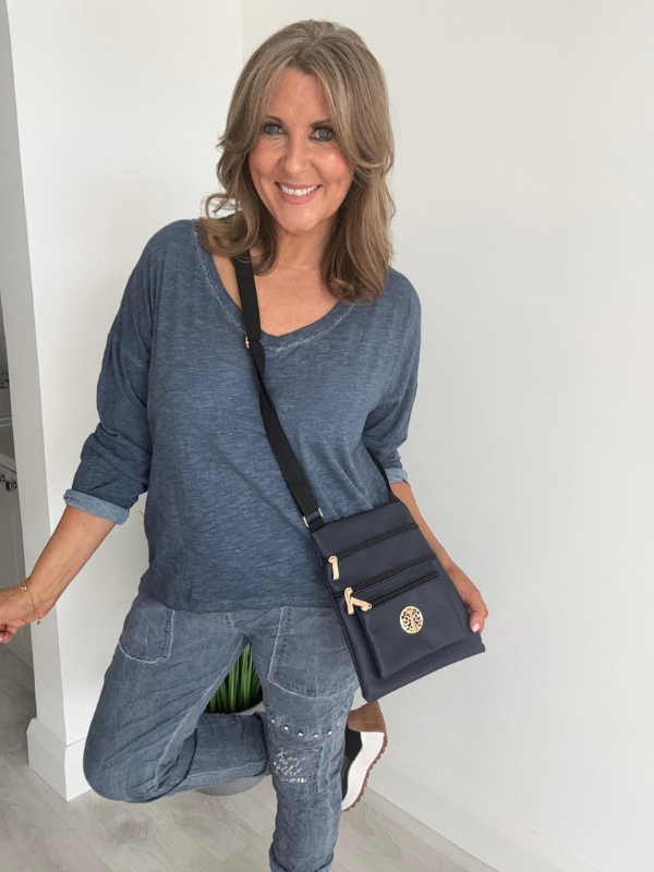 Relaxed fit long sleeve top with a V-neckline, soft washed finish, and breathable fabric, available in multiple colors