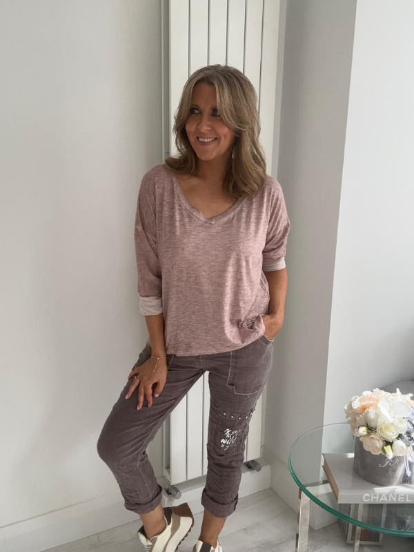 Relaxed fit long sleeve top with a V-neckline, soft washed finish, and breathable fabric, available in multiple colors
