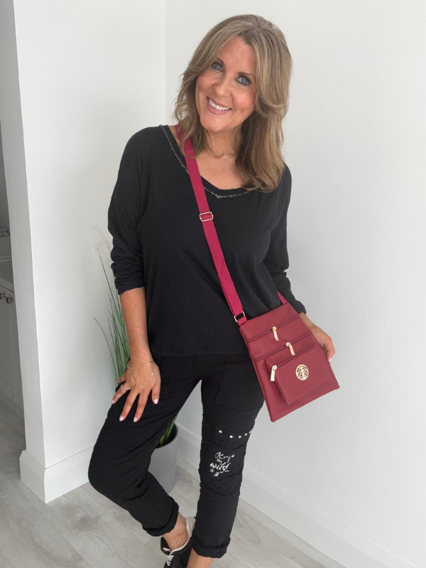 Relaxed fit long sleeve top with a V-neckline, soft washed finish, and breathable fabric, available in multiple colors