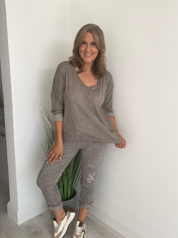 Relaxed fit long sleeve top with a V-neckline, soft washed finish, and breathable fabric, available in multiple colors