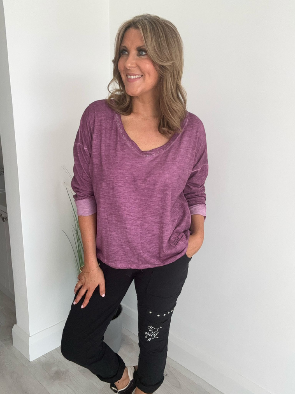 Relaxed fit long sleeve top with a V-neckline, soft washed finish, and breathable fabric, available in multiple colors