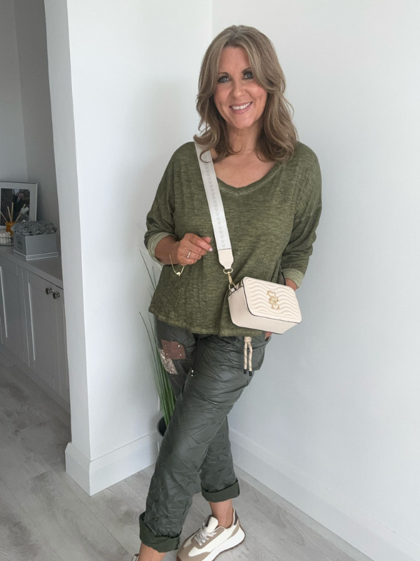 Relaxed fit long sleeve top with a V-neckline, soft washed finish, and breathable fabric, available in multiple colors