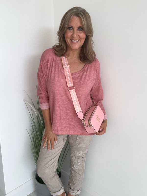 Relaxed fit long sleeve top with a V-neckline, soft washed finish, and breathable fabric, available in multiple colors