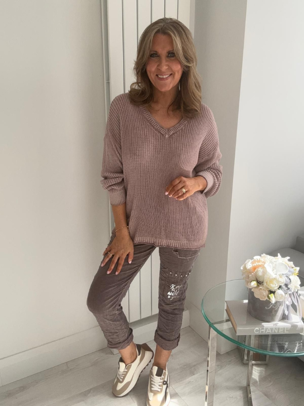 Soft casual knit V-neck sweater with a relaxed fit, ribbed cuffs, and lightweight fabric, perfect for year-round wear.