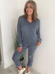 Soft casual knit V-neck sweater with a relaxed fit, ribbed cuffs, and lightweight fabric, perfect for year-round wear