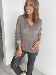 Soft casual knit V-neck sweater with a relaxed fit, ribbed cuffs, and lightweight fabric, perfect for year-round wear
