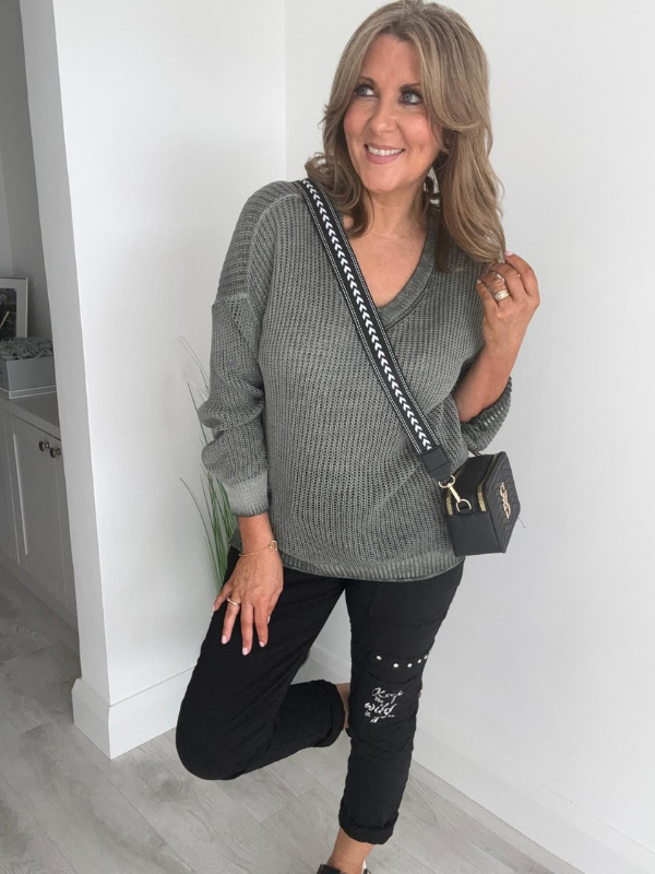 Soft casual knit V-neck sweater with a relaxed fit, ribbed cuffs, and lightweight fabric, perfect for year-round wear