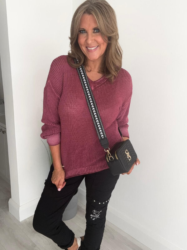 Soft casual knit V-neck sweater with a relaxed fit, ribbed cuffs, and lightweight fabric, perfect for year-round wear