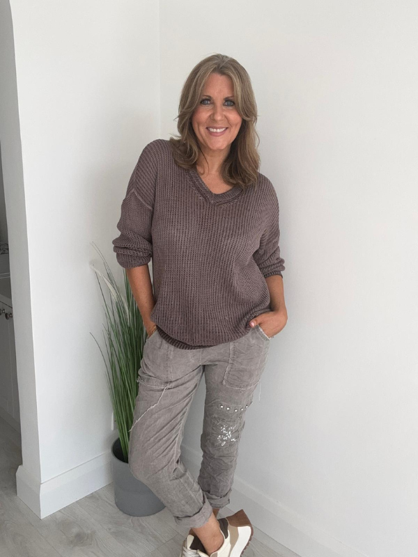 Soft casual knit V-neck sweater with a relaxed fit, ribbed cuffs, and lightweight fabric, perfect for year-round wear