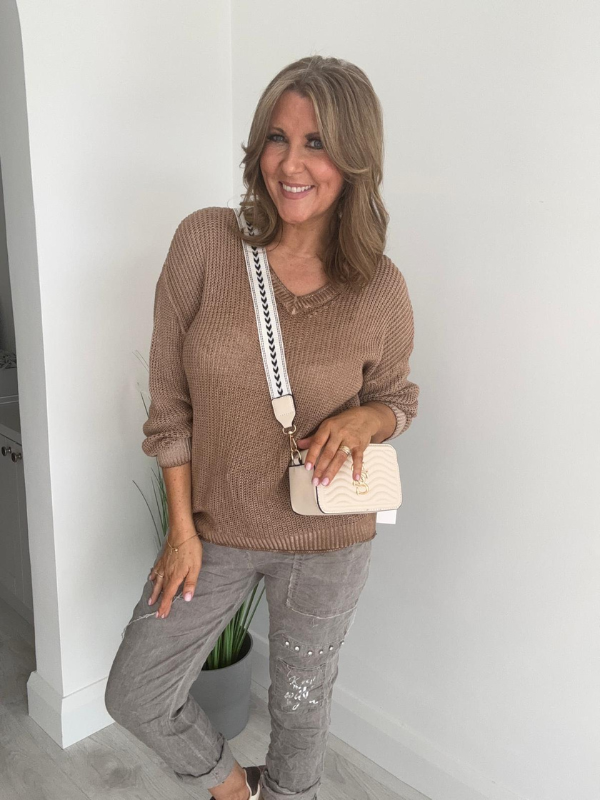 Soft casual knit V-neck sweater with a relaxed fit, ribbed cuffs, and lightweight fabric, perfect for year-round wear