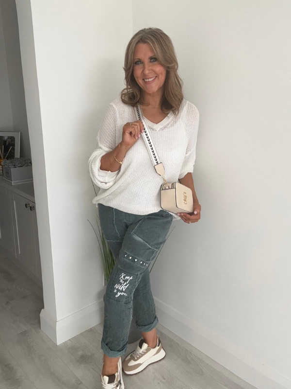 Soft casual knit V-neck sweater with a relaxed fit, ribbed cuffs, and lightweight fabric, perfect for year-round wear