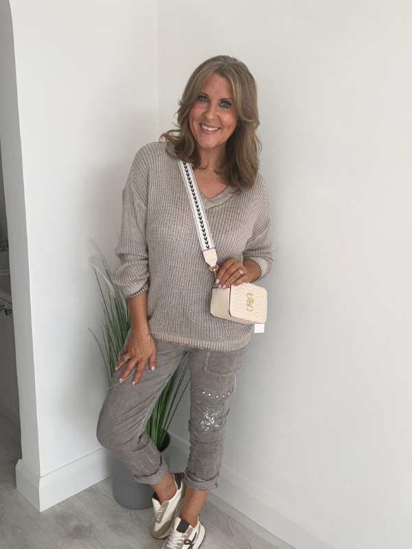 Soft casual knit V-neck sweater with a relaxed fit, ribbed cuffs, and lightweight fabric, perfect for year-round wear