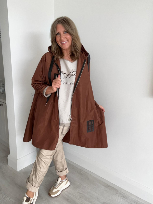 Classic rain mac coat, waterproof with a hood, designed for all-weather wear