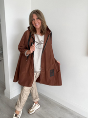 Classic rain mac coat, waterproof with a hood, designed for all-weather wear
