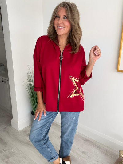 Women's casual zip-up jacket with long sleeves, featuring a decorative star detail on the side, paired with jeans. Available in multiple colors