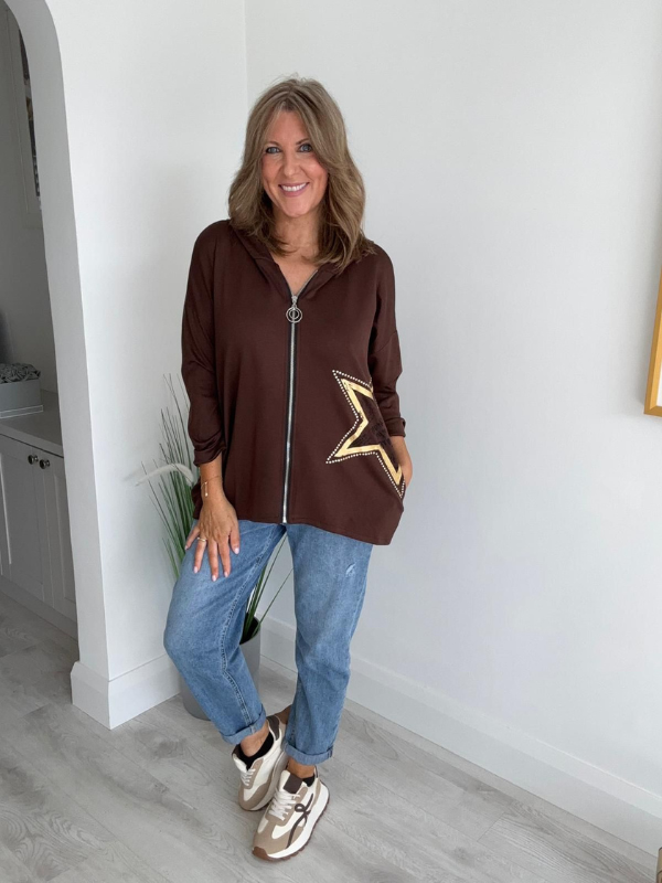 Women's casual zip-up jacket with long sleeves, featuring a decorative star detail on the side, paired with jeans. Available in multiple colors