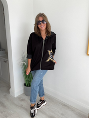 Women's casual zip-up jacket with long sleeves, featuring a decorative star detail on the side, paired with jeans. Available in multiple colors