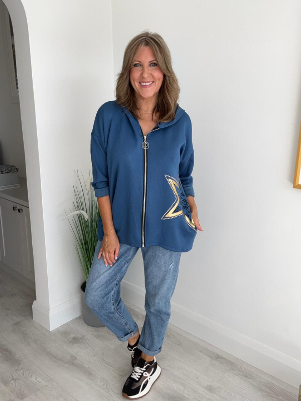 Women's casual zip-up jacket with long sleeves, featuring a decorative star detail on the side, paired with jeans. Available in multiple colors