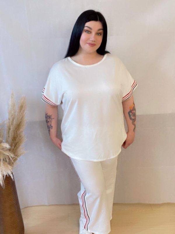Model wearing a comfortable two-piece co-ord set with stripe trim, Designed for casual wear with a sporty twist.