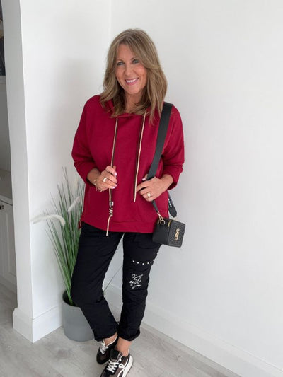 Women’s casual hooded top with drawstring, free size fit (UK 10–18), available in multiple colours, designed for everyday casual wear and layering.