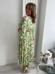 Plus size tropical bloom wrap midi dress for UK sizes 14–24 styled with sandals


