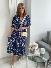 Lightweight navy abstract wrap dress for UK sizes 14–24 styled with heels