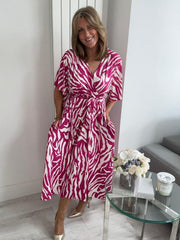 Soft polyester blend zebra print midi dress perfect for brunch or holidays