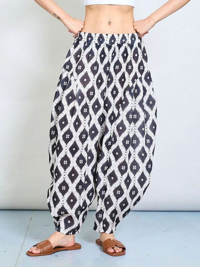 Geometric tie-dye harem trousers with relaxed fit and elastic waistband – available in black, green, blue, free size 8–20
