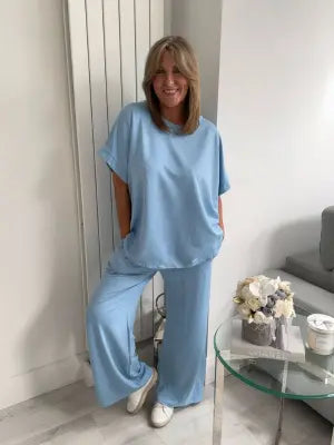 Light Scuba Co-Ord Set made from soft, breathable scuba fabric, available in five colours: navy, khaki, winter white, powder blue, and pink. Two-piece relaxed fit outfit available in Size 1 (UK 10–16) and Size 2 (UK 18–22), designed for all-day comfort and effortless style.