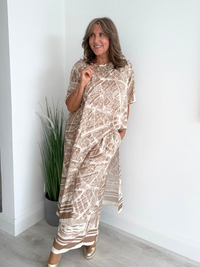 Two-piece vintage city map print co-ord set featuring an asymmetrical hem tunic and relaxed-fit wide-leg trousers – fits UK sizes 8–20 – available in Black, Beige.