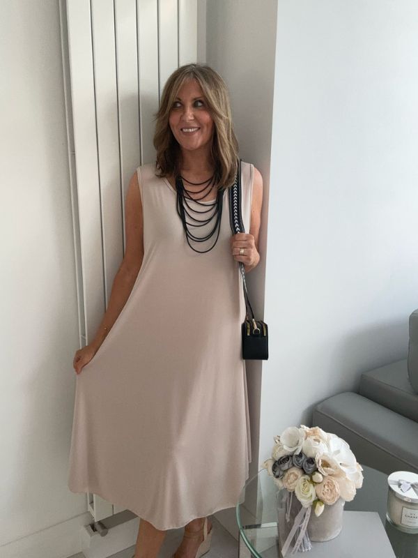 Plus-size women’s sleeveless swing midi dress in soft lightweight fabric, available in six colours including nude beige, hot pink, lavender purple, white, black, and taupe grey, designed for UK sizes 14–22.