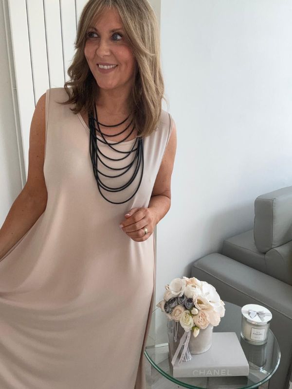 Plus-size women’s sleeveless swing midi dress in soft lightweight fabric, available in six colours including nude beige, hot pink, lavender purple, white, black, and taupe grey, designed for UK sizes 14–22.