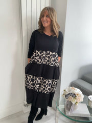 Black and animal print tiered midi dress with 3/4 sleeves, lightweight fabric, and flattering loose fit, suitable for UK sizes 8–18