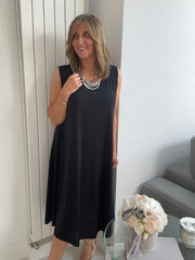 Plus-size women’s sleeveless swing midi dress in soft lightweight fabric, available in six colours including nude beige, hot pink, lavender purple, white, black, and taupe grey, designed for UK sizes 14–22.