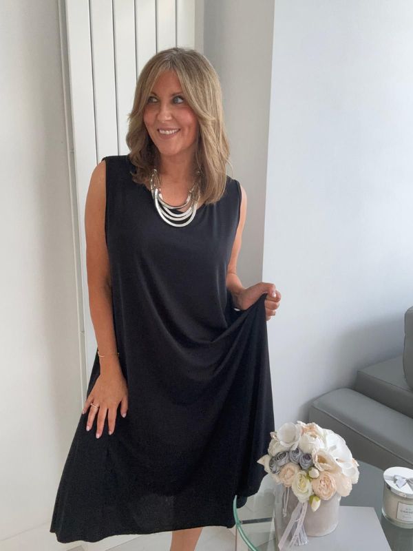 Plus-size women’s sleeveless swing midi dress in soft lightweight fabric, available in six colours including nude beige, hot pink, lavender purple, white, black, and taupe grey, designed for UK sizes 14–22.