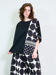 Plus size oversized blouse with polka dots and stripes, featuring asymmetric sleeves and modern abstract prints