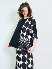 Plus size oversized blouse with polka dots and stripes, featuring asymmetric sleeves and modern abstract prints