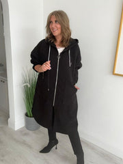 Women’s Curvy Range oversized coat, free size fits 18–24. Features a relaxed zip-up front, large pockets, and drawstring hood.