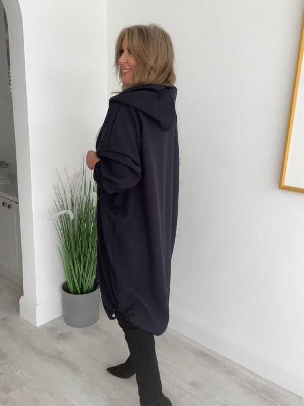 Women’s Curvy Range oversized coat, free size fits 18–24. Features a relaxed zip-up front, large pockets, and drawstring hood.