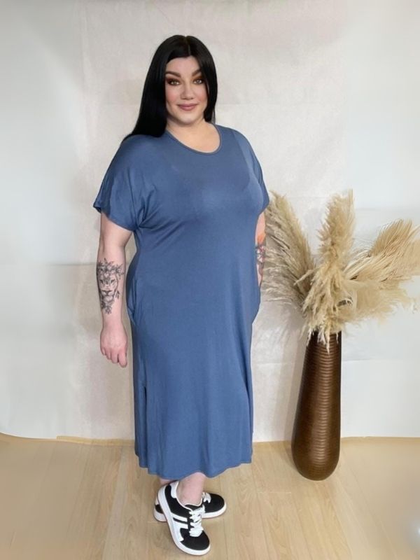 Model wearing AUSELILY Women's Summer Maxi Dress featuring short sleeves, side slit, rounded neck, and functional pockets – Comfortable and Casual Summer Outfit