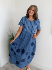 Denim blue midi dress featuring mixed print design and side pockets – relaxed summer outfit