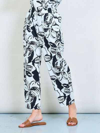 Black floral brushstroke print trousers with elastic waist and side pockets, free size 8–20