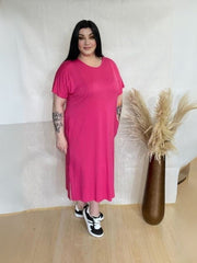 Model wearing AUSELILY Women's Summer Maxi Dress featuring short sleeves, side slit, rounded neck, and functional pockets – Comfortable and Casual Summer Outfit