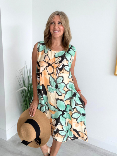 Printed sleeveless mini dress with A-line fit and side pockets – lightweight and breathable, free size fits 8–20