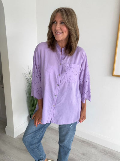 Embroidered cotton shirt with 3/4 sleeves, functional buttons, and a curved longer back hem with eyelet detail, made from breathable cotton and designed for UK sizes 8–20.