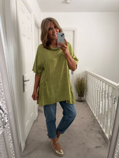 Vintage-inspired oversized grid print top with cowl neckline and short sleeves, made from lightweight breathable fabric. Available in free size (UK 8–20) and four stylish colours.