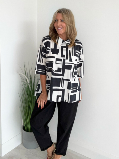 Model wearing black and white geometric print cowl neck tunic with 3/4 sleeves – fits UK 8–20