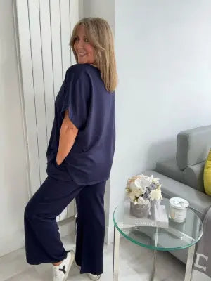 Light Scuba Co-Ord Set made from soft, breathable scuba fabric, available in five colours: navy, khaki, winter white, powder blue, and pink. Two-piece relaxed fit outfit available in Size 1 (UK 10–16) and Size 2 (UK 18–22), designed for all-day comfort and effortless style.